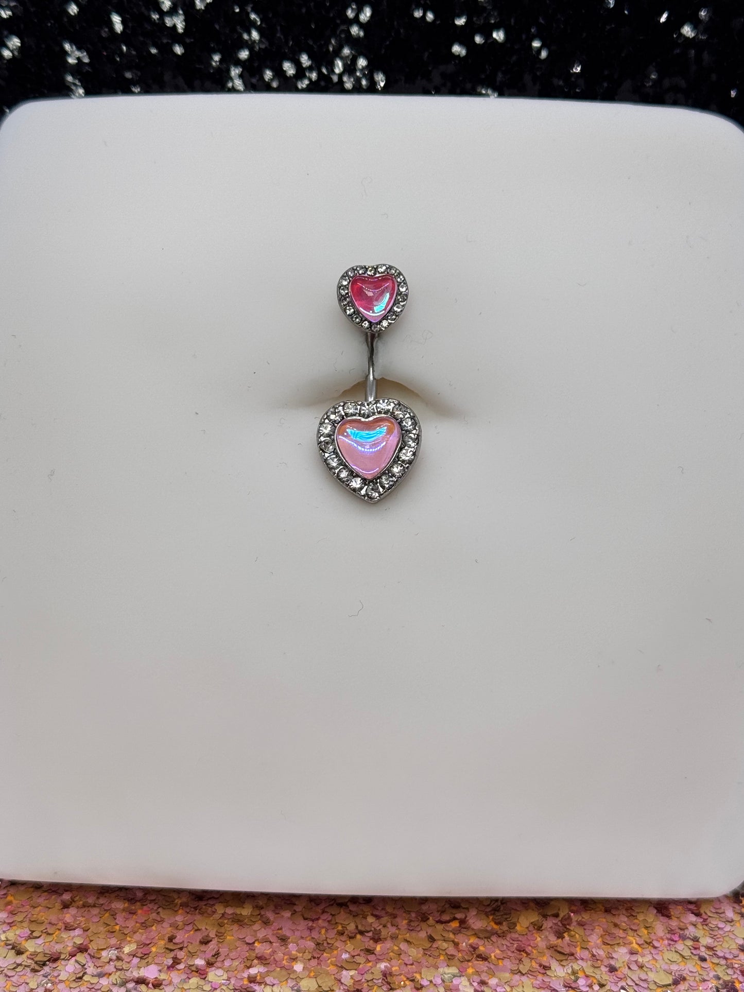 Bright pink heart belly ring
